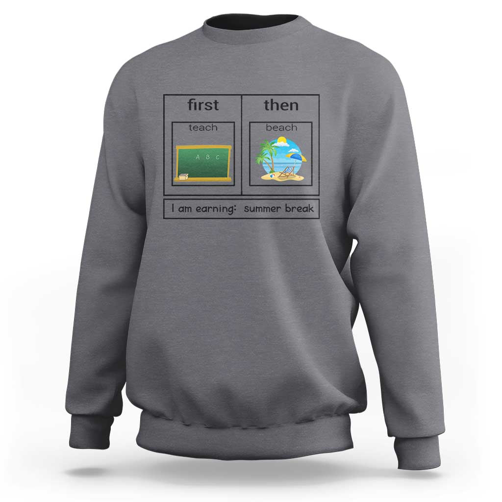 Charcoal crewneck sweatshirt with “first teach then beach” graphic and “I am earning: summer break”