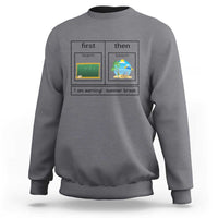 Charcoal crewneck sweatshirt with “first teach then beach” graphic and “I am earning: summer break”