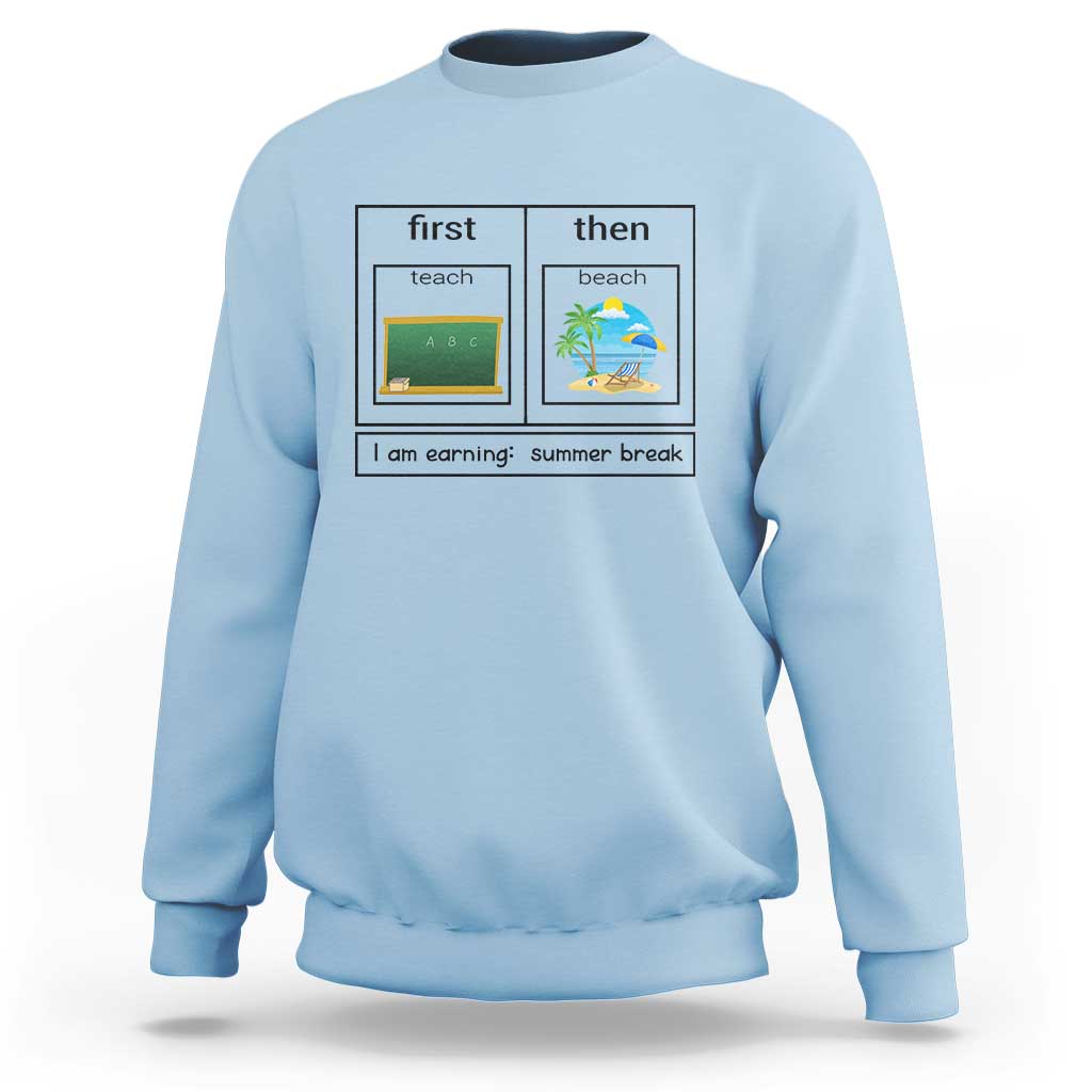 Light blue crewneck sweatshirt with “first teach then beach” graphic and “I am earning: summer break”