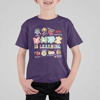 Kids purple T-shirt with colorful PLAY IS LEARNING classroom graphic