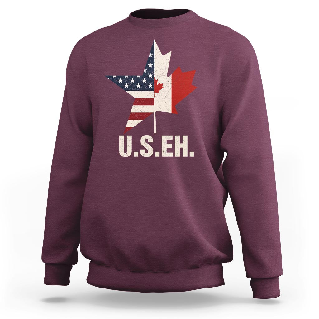 Maroon sweatshirt with U.S.E.H text and US/Canada flag map graphic on front