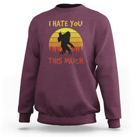Maroon crewneck sweatshirt with Bigfoot silhouette and “I HATE YOU THIS MUCH” print