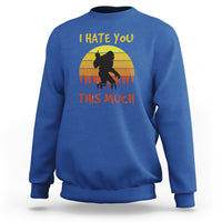 Royal blue crewneck sweatshirt with Bigfoot silhouette and “I HATE YOU THIS MUCH” print