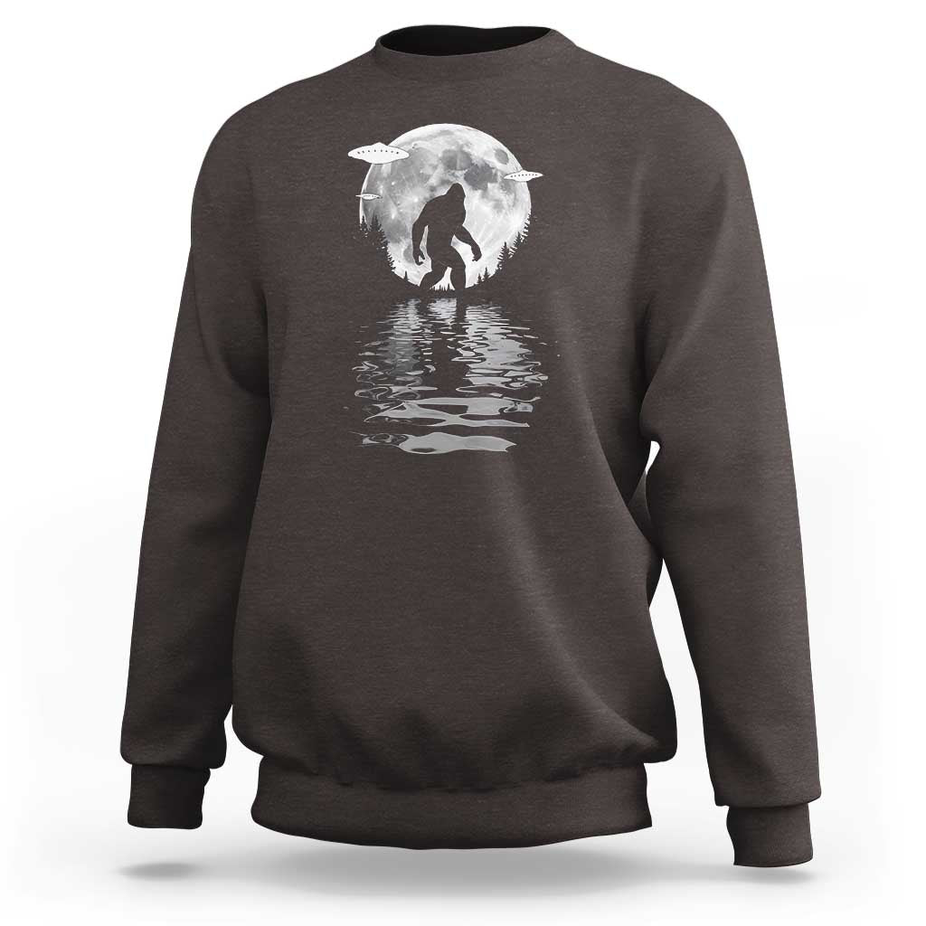 Dark chocolate crewneck sweatshirt with Bigfoot under a moon graphic and reflection print