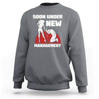 Charcoal gray crewneck sweatshirt with “Soon Under New Management” graphic