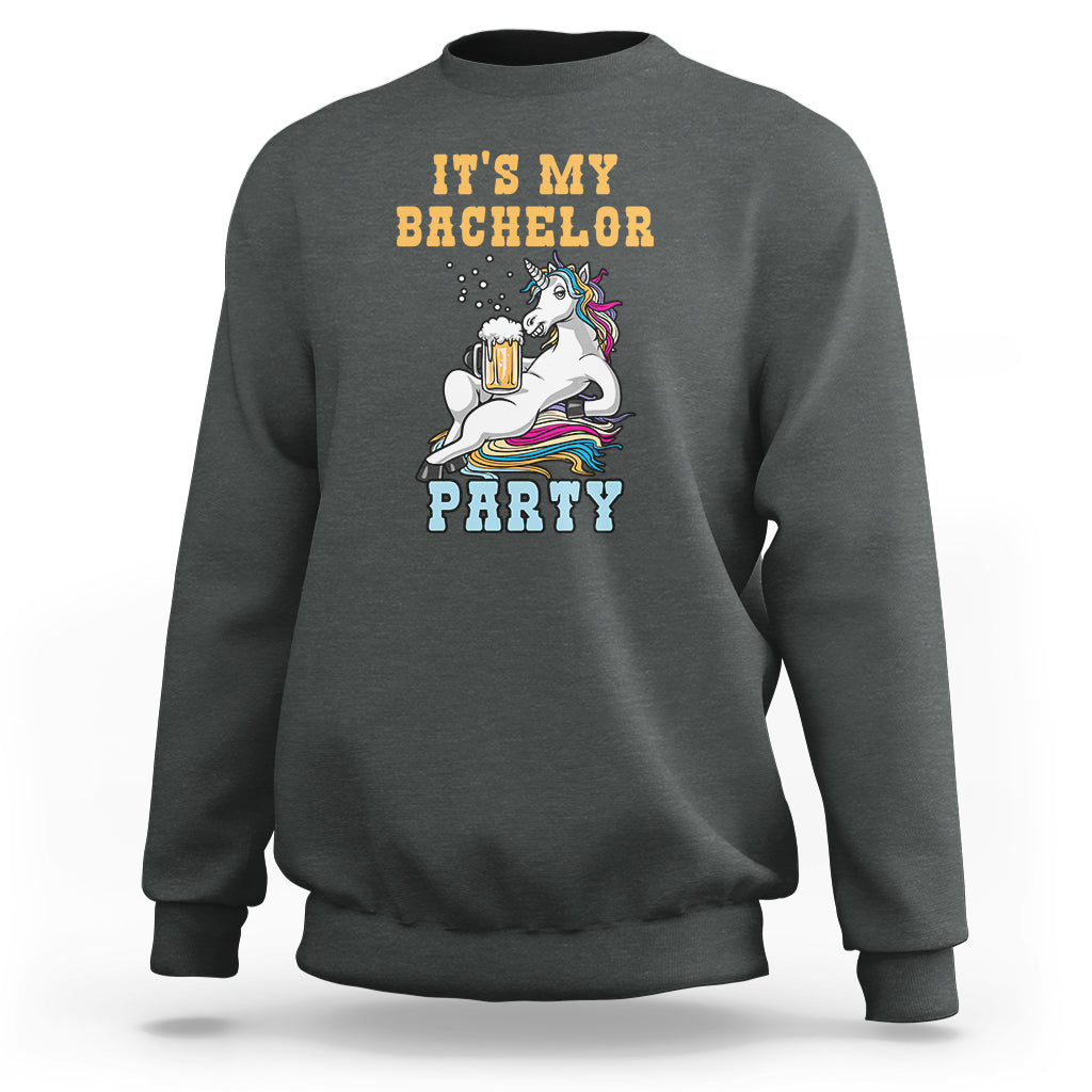 Dark heather gray crewneck sweatshirt with “It’s My Bachelor Party” graphic and unicorn holding a beer