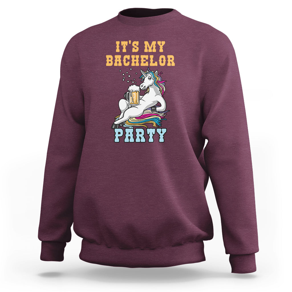 Maroon crewneck sweatshirt with “It’s My Bachelor Party” graphic and unicorn holding a beer