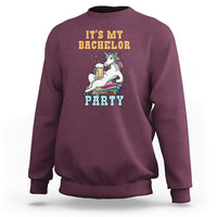 Maroon crewneck sweatshirt with “It’s My Bachelor Party” graphic and unicorn holding a beer