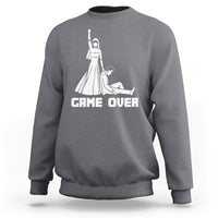 Charcoal gray crewneck sweatshirt with white "GAME OVER" graphic and character illustration