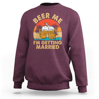 Maroon crewneck sweatshirt with Beer Me graphic and “I’m getting married” text