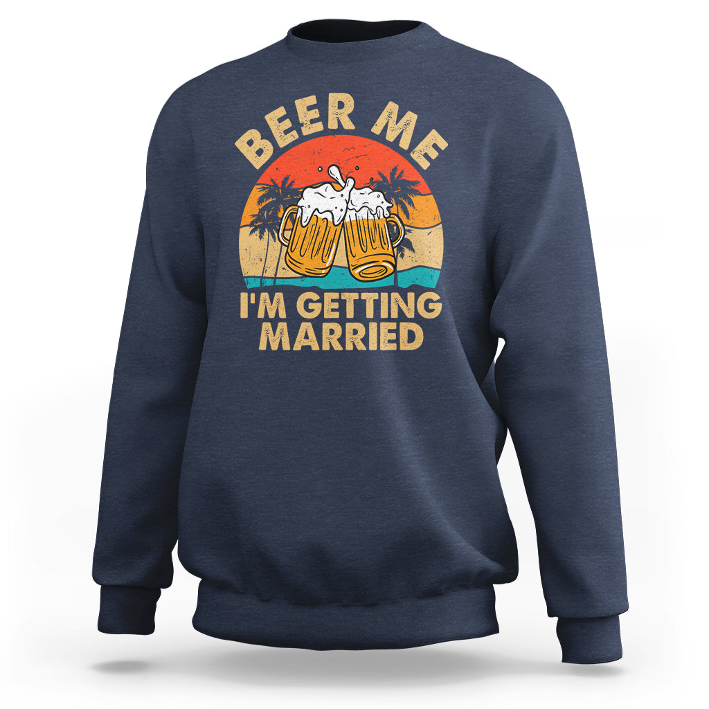 Navy crewneck sweatshirt with Beer Me graphic and “I’m getting married” text