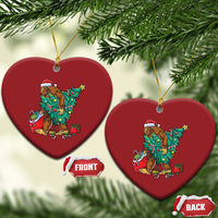 Two red heart-shaped Bigfoot Christmas ornaments with Santa hat, decorated tree and gifts