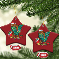 Two red star-shaped Bigfoot Christmas ornaments with Santa hat, decorated tree and gift boxes
