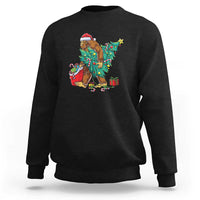 Black Bigfoot Christmas sweatshirt with tree lights, gifts, and candy cane graphic