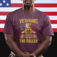 Maroon graphic T-shirt with eagle, rifles, and 'Remember the Fallen' Veterans Day print