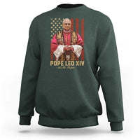 Dark forest green pullover sweatshirt with Pope portrait graphic over American flag and 'POPE LEO XIV' text