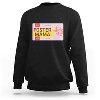 Black sweatshirt with “Foster Mama” graphic on back