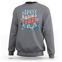 Charcoal gray crewneck sweatshirt with colorful 'Bonus Mom' graphic on chest