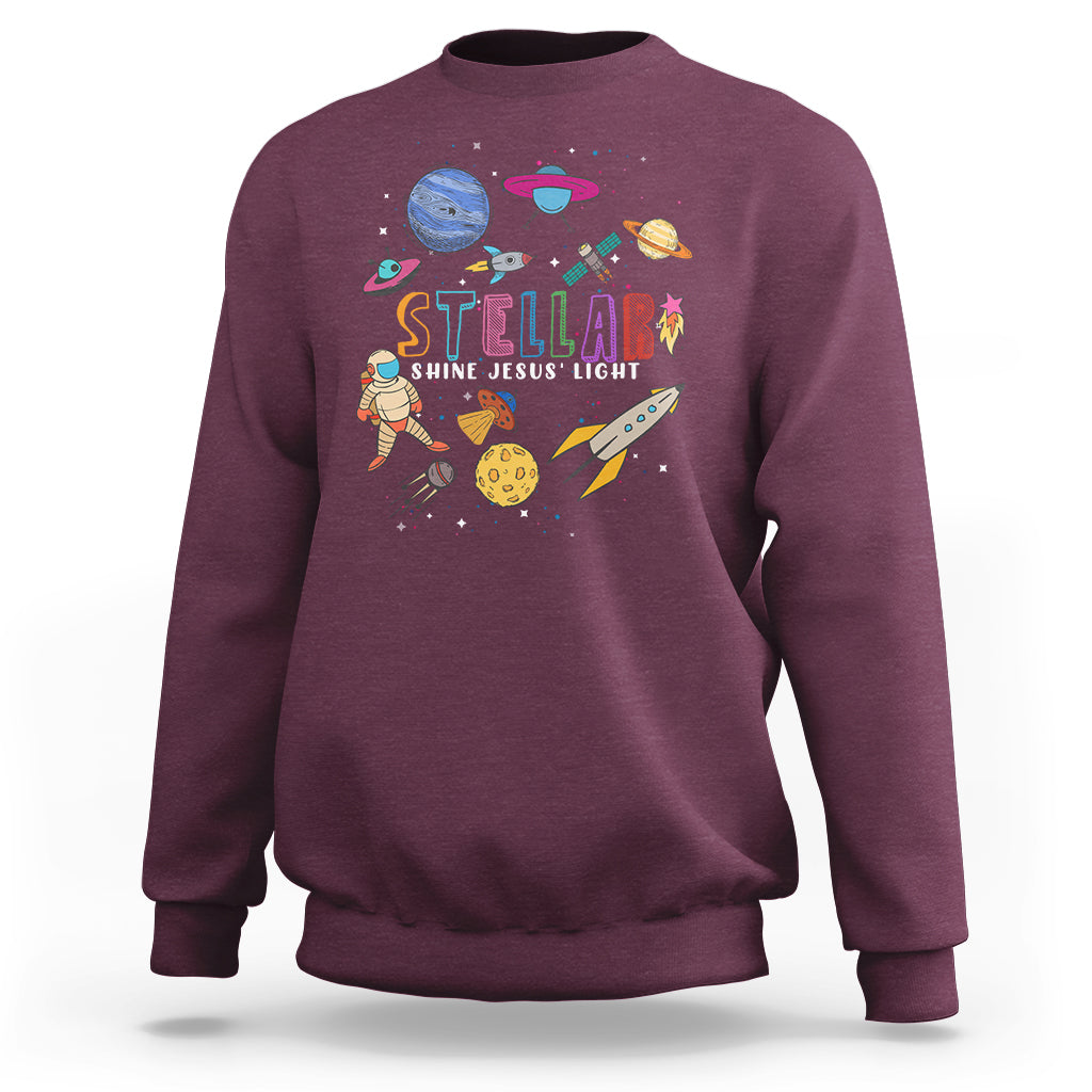 Maroon crewneck sweatshirt with colorful space-themed front graphic and logo