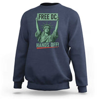 Navy crewneck sweatshirt with 'FREE DC HANDS OFF!' Statue of Liberty graphic.