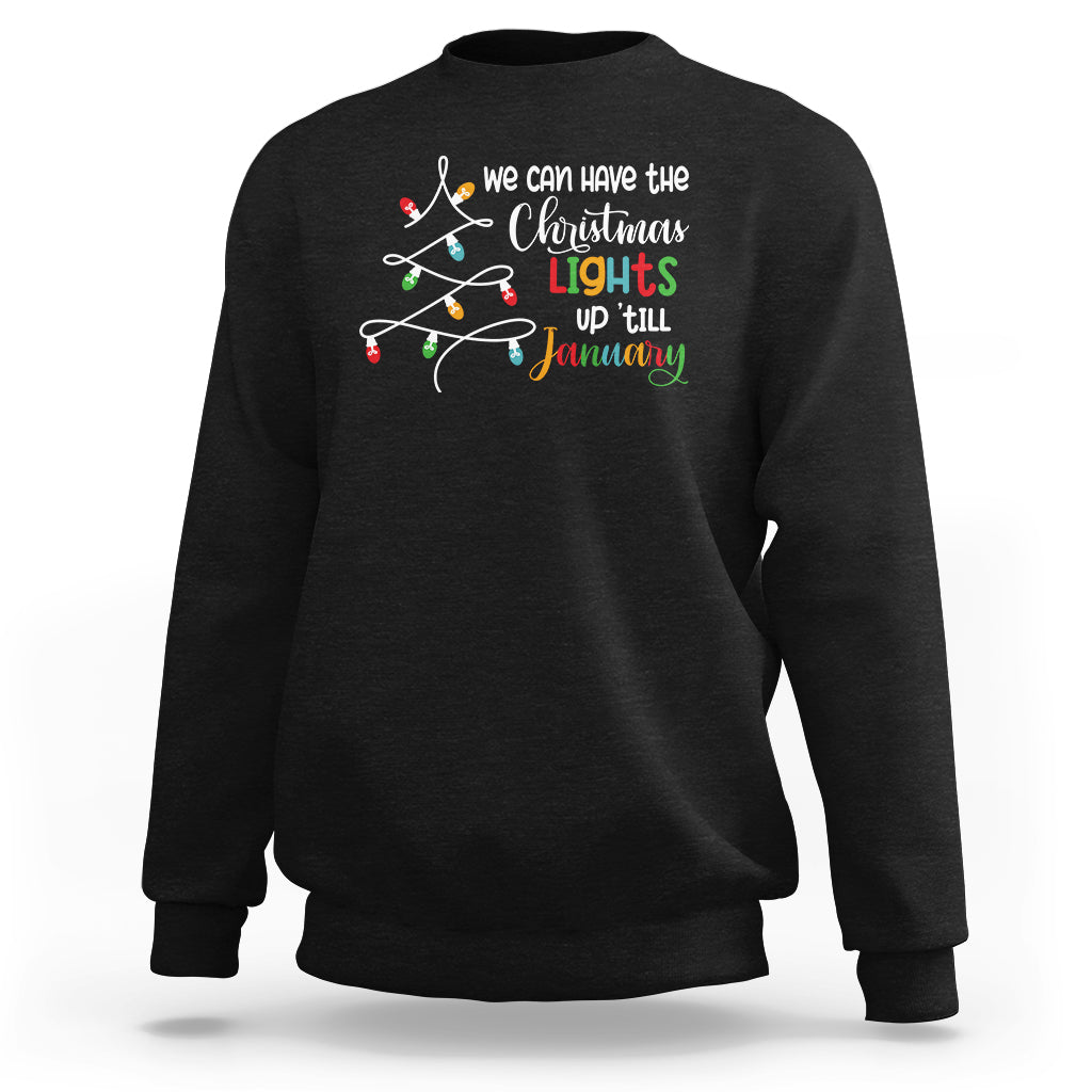 Black crewneck sweatshirt with colorful Christmas lights graphic and 'up till January' text