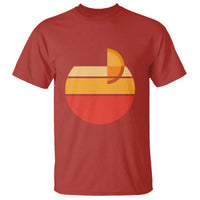 Red crew-neck T-shirt with retro sunset graphic in orange, yellow, and red.
