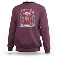 Maroon Christmas sweatshirt with dancing skeleton Santa graphic on the chest