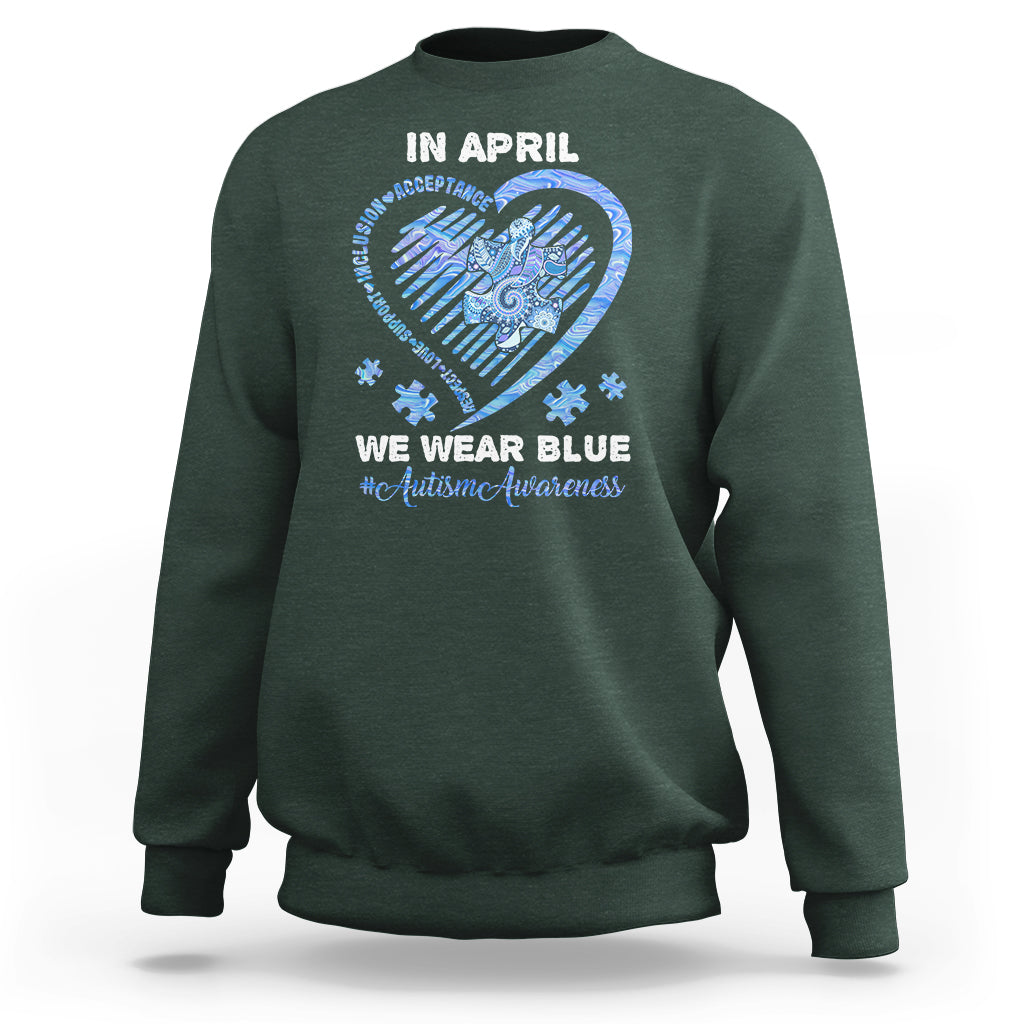Forest green crewneck sweatshirt with 'In April' heart graphic and slogan on back.