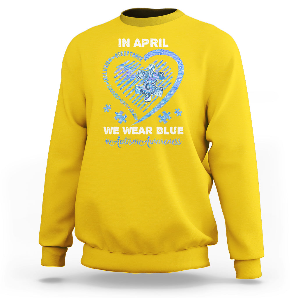 Daisy yellow crewneck sweatshirt with 'In April' heart graphic and slogan on back.