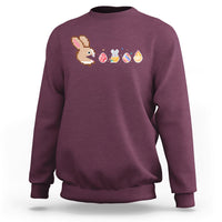 Maroon crewneck sweatshirt with pixel bunny and Easter eggs graphic across chest
