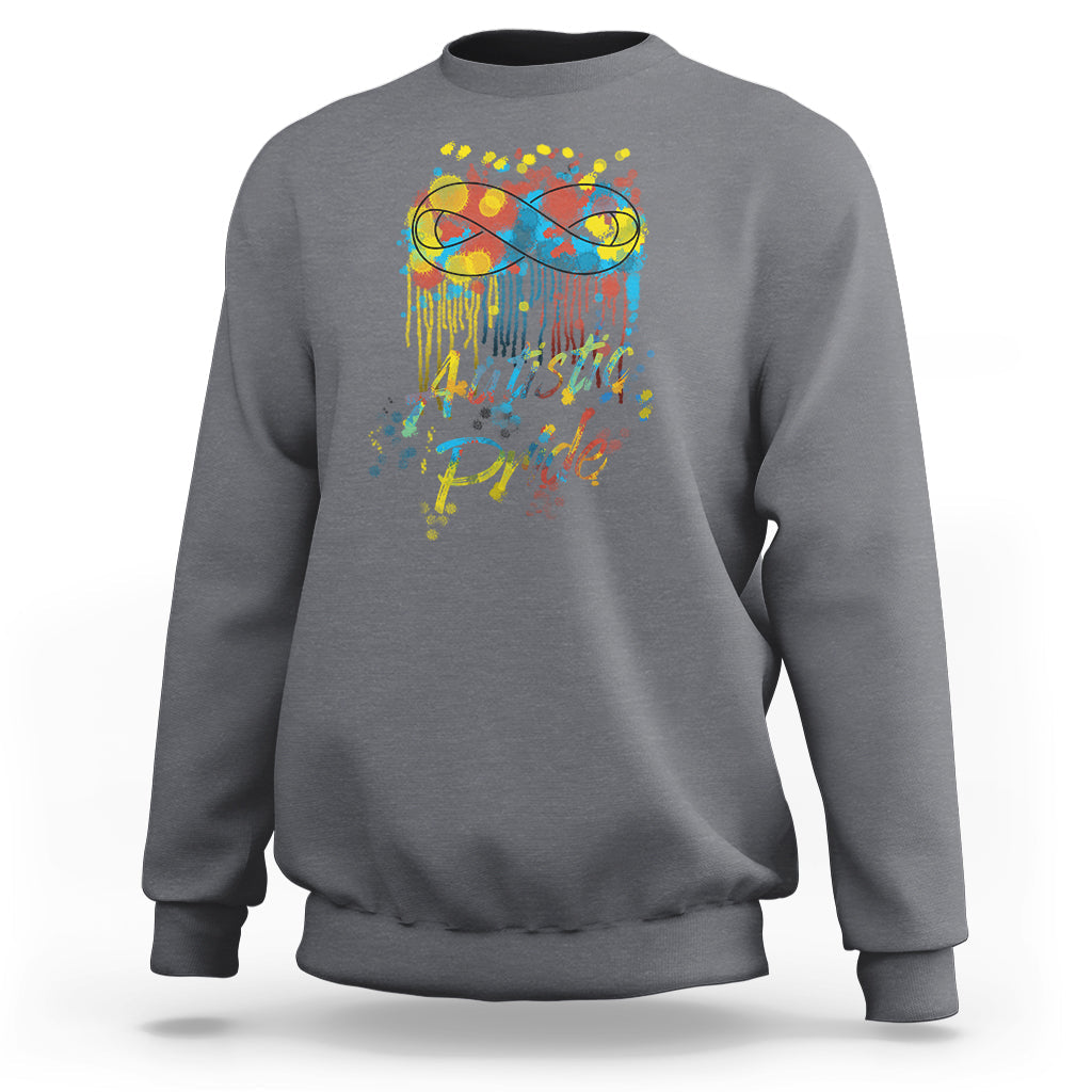 Charcoal gray sweatshirt with colorful "Autistic Pride" graphic and glasses on back