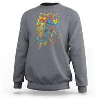 Charcoal gray sweatshirt with colorful "Autistic Pride" graphic and glasses on back