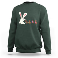 Forest green Easter sweatshirt with cute bunny eating chocolate graphic on front.