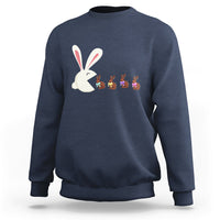 Navy Easter sweatshirt with cute bunny eating chocolate graphic on front.