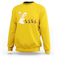 Daisy yellow Easter sweatshirt with cute bunny eating chocolate graphic on front.