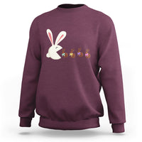 Maroon Easter sweatshirt with cute bunny eating chocolate graphic on front.