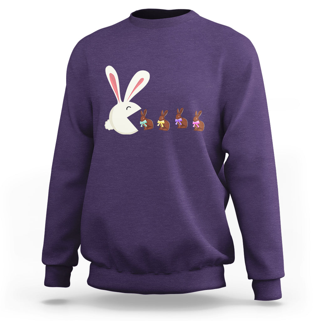 Purple Easter sweatshirt with cute bunny eating chocolate graphic on front.