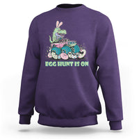 Kids' crewneck sweatshirt in purple with Easter dinosaur-bunny graphic, 'EGG HUNT IS ON'.