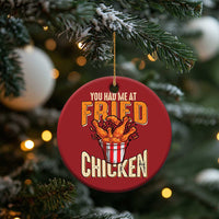 Red round Christmas ornament reading 'You Had Me At Fried Chicken' with chicken bucket graphic