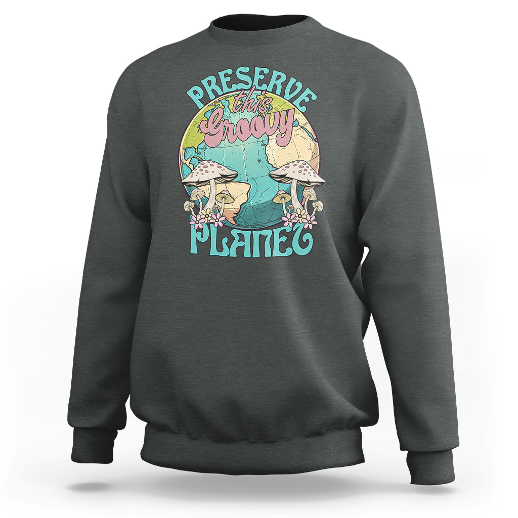 Dark heather gray crewneck sweatshirt with front graphic "Preserve this naughty planet".