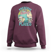 Maroon crewneck sweatshirt with front graphic "Preserve this naughty planet".