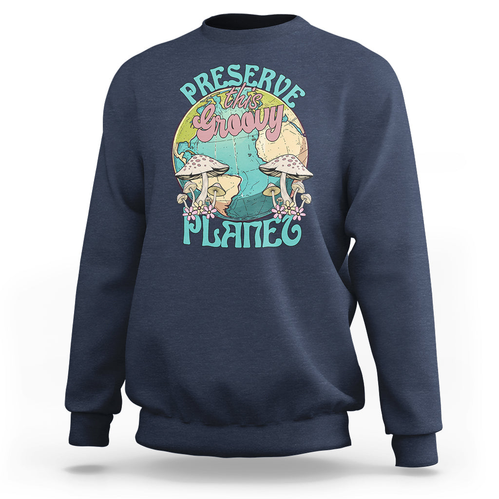 Navy crewneck sweatshirt with front graphic "Preserve this naughty planet".