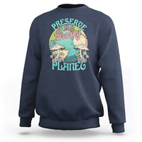 Navy crewneck sweatshirt with front graphic "Preserve this naughty planet".