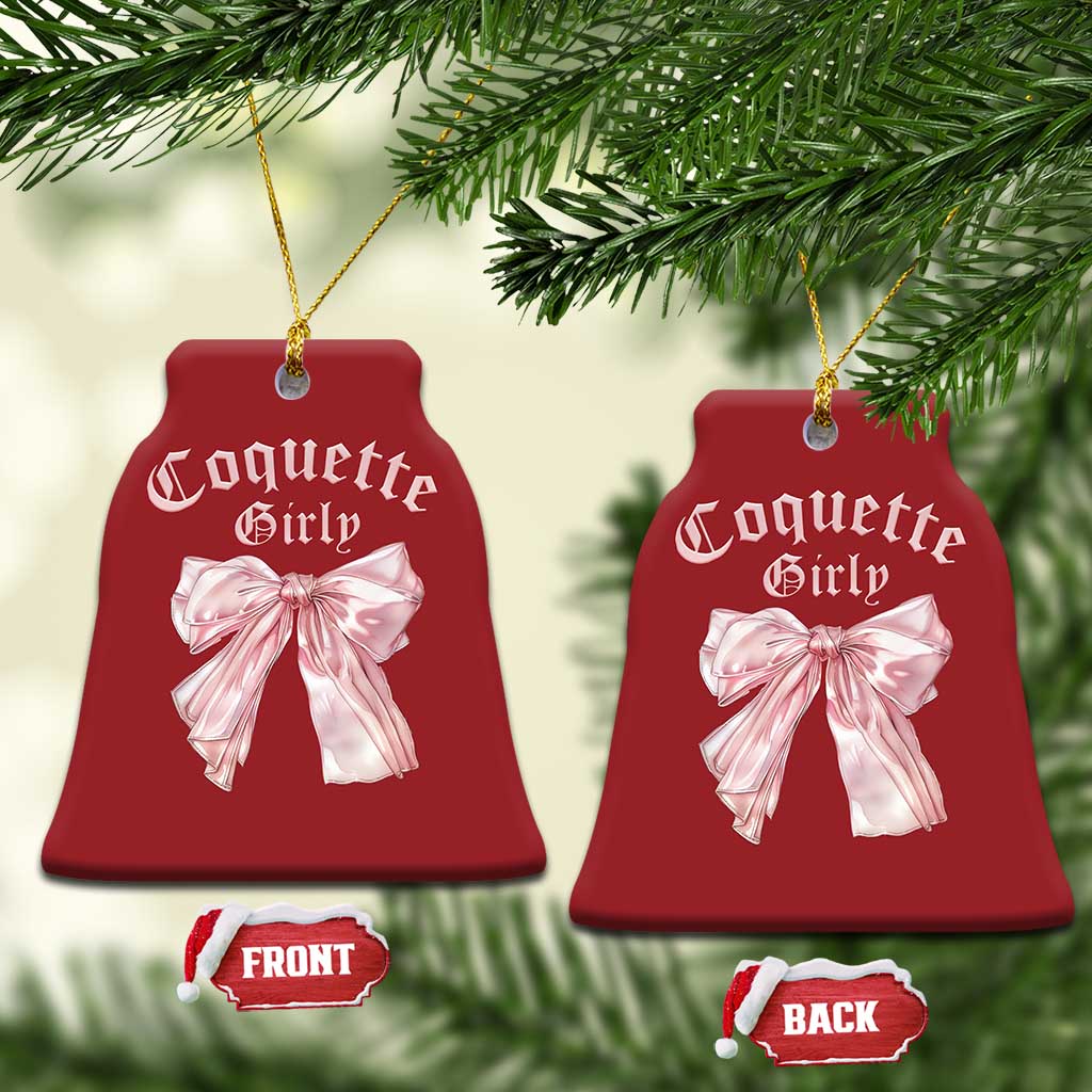 Set of red bell-shaped Christmas ornaments with pink bows and gold hanging strings