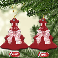 Pair of red bell Christmas ornaments with pink bows and gold hanging strings