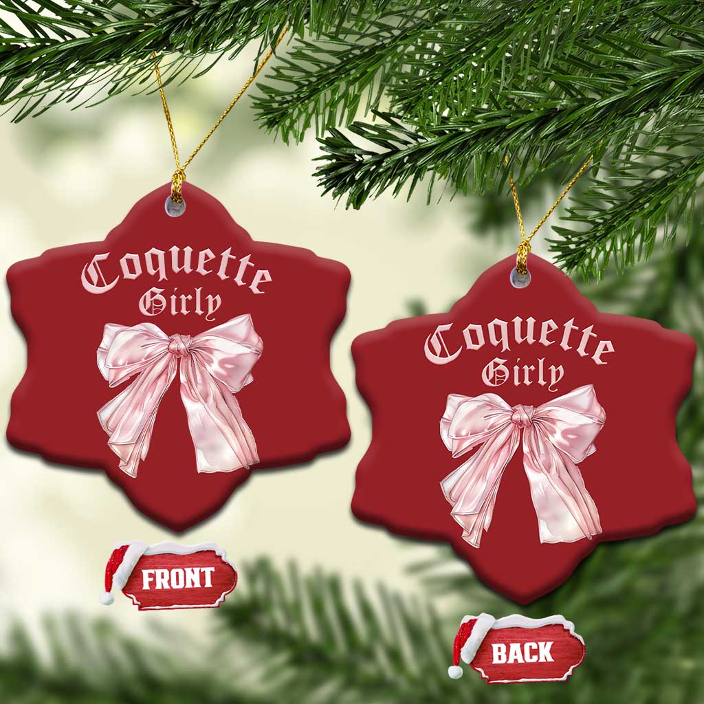 Pair of red heart Christmas ornaments with pink bows and gold hanging strings