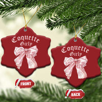 Pair of red heart Christmas ornaments with pink bows and gold hanging strings