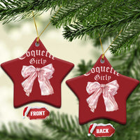 Set of red star Christmas ornaments with pink bows and gold hanging strings
