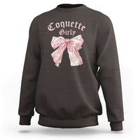 Dark chocolate crewneck sweatshirt with pink bow graphic on chest, ribbed cuffs and hem.