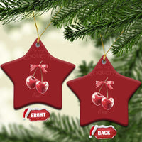 Red star-shaped ornament with pink ribbon bow and two cherry charms, front and back shown